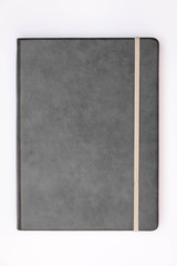 Grey cover of notebook with whit background.