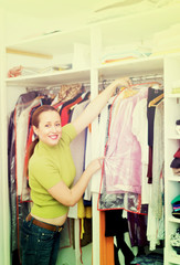 Female choosing apparel at store