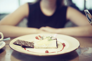 girl eating dessert in cafe