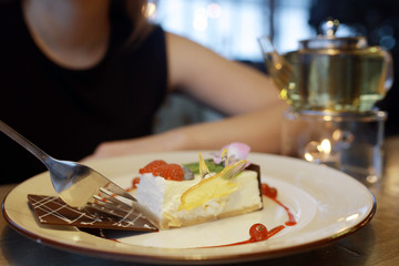 girl eating dessert in cafe