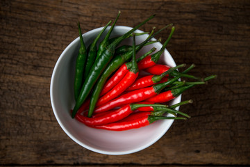 hot chili peppers on a wooden board