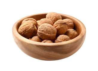Walnuts in wooden plate isolated on white