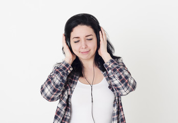 Young woman or girl listening to her favorite song closed eyes a