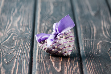Heart from cloth on wood desk