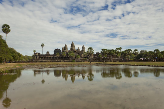 Classic view of Angkor Wat reflecting the the pond in front of the ancient monument   