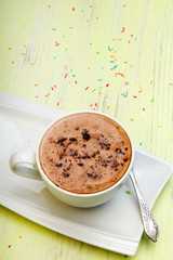 Cup of coffee green wooden background, copy space