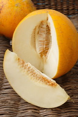 Ripe melon on wicker background