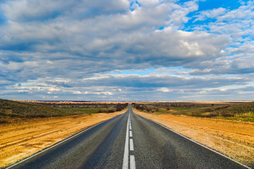 Empty straight road in the desert, the highway M6 