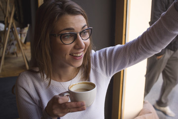 Woman waving to someone