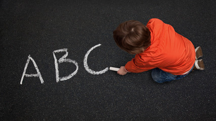 Cute Boy, with Chalk on Street/Tarmac, Learning his ABC