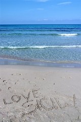 view of sicilian beach with love written on sand