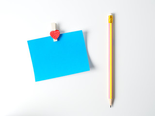 Notepad and pencil on a white background..
