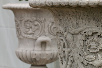Details of carved stone flowerpots reliefs