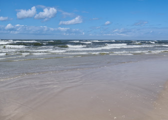 Baltic Sea - water waves. Beautiful blue sky and turbulent sea.