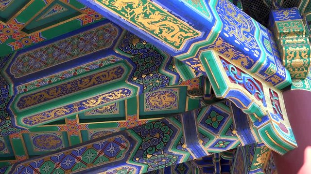 Close paint details tilt. Beautiful Summer emperor Palace lake garden Beijing China. Sunny day. 4K cinematic.