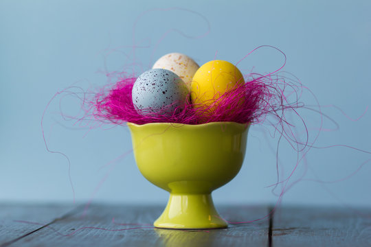 Easter eggs of bright colors, closeup and pink  decoratie