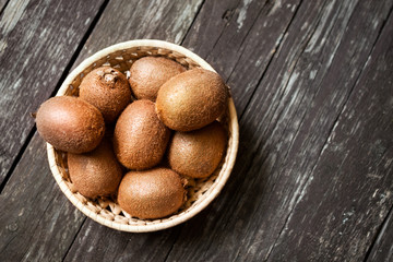 fresh kiwi fruit with filled bowl.