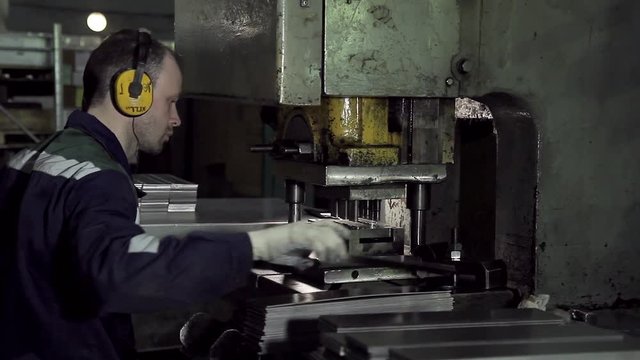 Machine operator working at factory