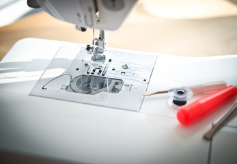 Sewing machine, spool, tool