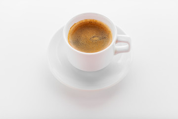 Cup of coffee on a wooden table.