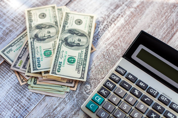 Fototapeta premium calculator isolated on a wooden background