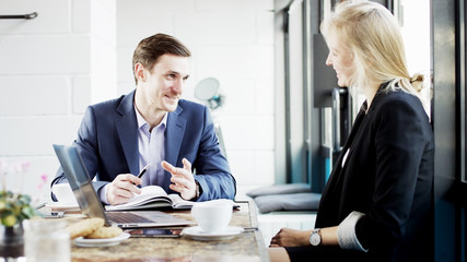 Two Young Business People Smiling