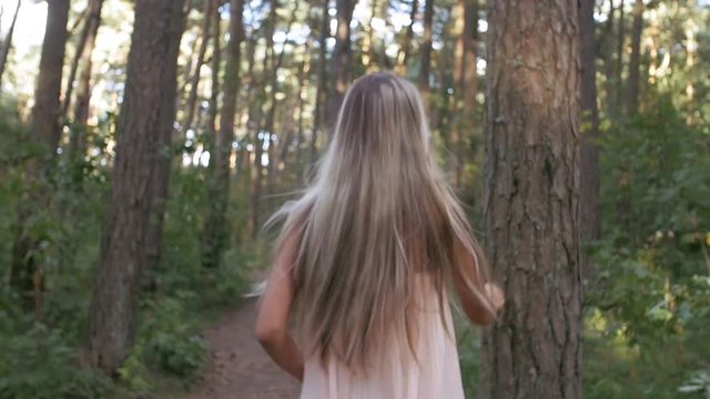 Girl runs through a thicket