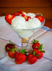 Ice cream with fresh strawberry. Selective focus