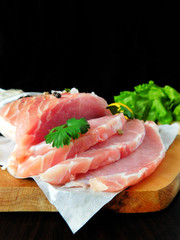 Fresh sliced pork carbonade on a wooden board 