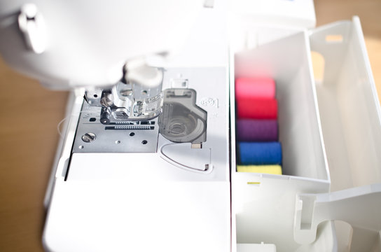 Sewing machine and thread in a box