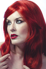 Fototapeta premium Beautiful Spanish woman in lace dress and great red hair, romantic or medieval style