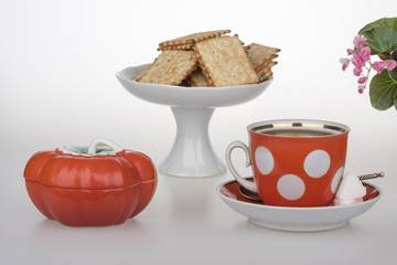 Red cup of coffee French crackers