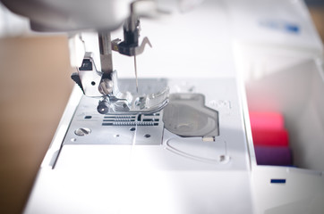 Sewing machine and thread in a box