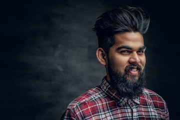 Fototapeta premium A handsome bearded Indian male dressed in a fleece shirt.