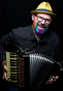 Man With Colorful Beard Playing The Accordion