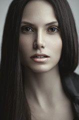Beauty portrait of young beautiful sensual model with long straight brown hair.