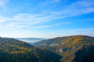 Colorful autumn mountain valley in the mist