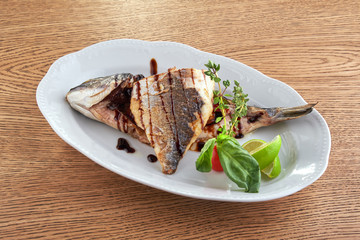 Fried fish on a white plate