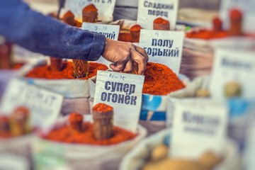 Vivid oriental central asian market with bags full of various spices in Osh bazar in Bishkek, Kyrgyzstan.