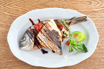 Fried fish on a white plate