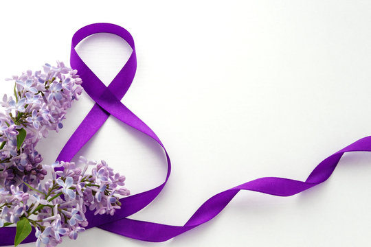 International Women's Day. 8 March. Decoration with Purple Ribbon and Lilac on a white background. Greeting Card.