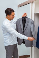 Businessman dressing up for work