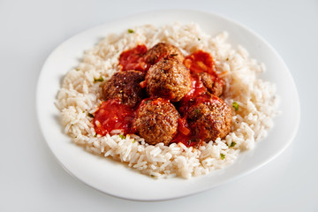 Saucy Homemade Meatballs on a Bed of White Rice