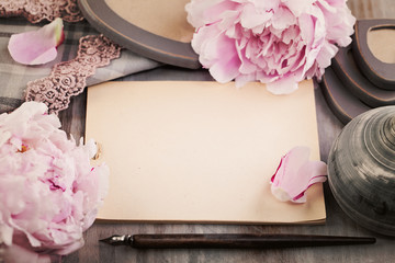 Nostalgic Background with Paper, Spring Flowers and Pen on Wooden Deck
