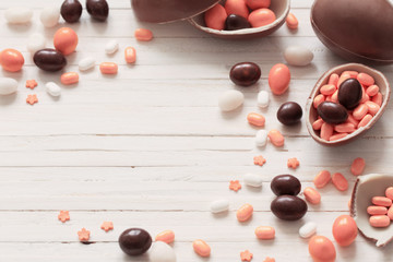 Naklejka na ściany i meble Chocolate Easter Eggs Over Wooden Background