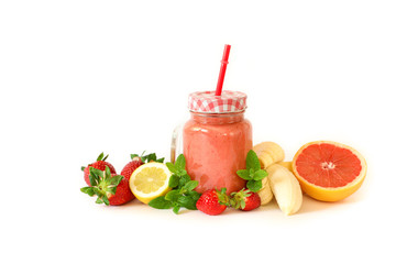 Strawberry smoothie with banana, grapefruit, lemon and mint leaves.