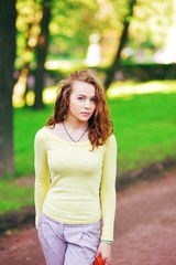 Fototapeta premium portrait of a beautiful brown-haired girl with big eyes and a calm look.