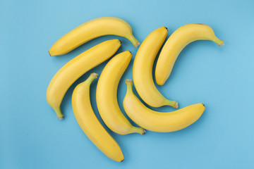 Group of bananas on blue background.