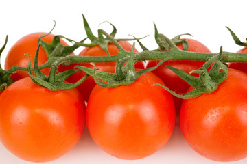 cherry tomatoes with dew closeup on a white background