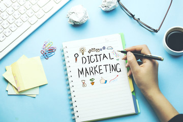 woman written digital marketing text on desk
